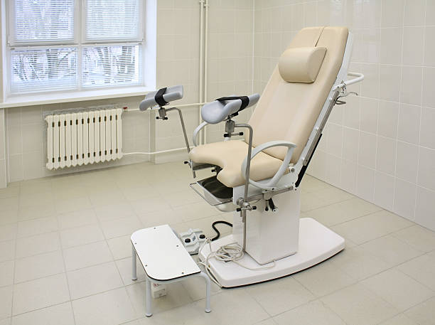 Gynecological chair in a medical office An empty chair in gynecological medical office water birth stock pictures, royalty-free photos & images