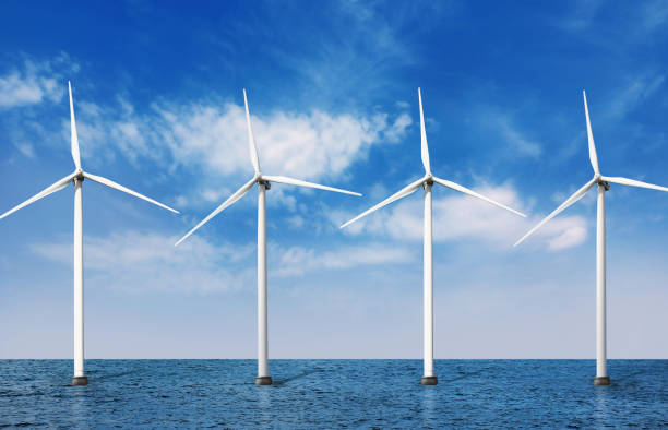 istock Floating wind turbines installed in sea under blue sky. Alternative energy source 1353761508