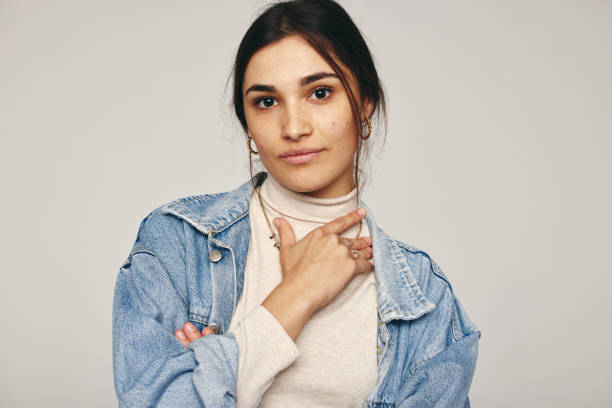 istock Young woman looking at the camera in a studio 1353761690