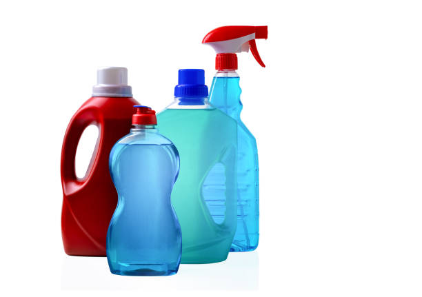 Different bottles with detergents against a white background stock photo