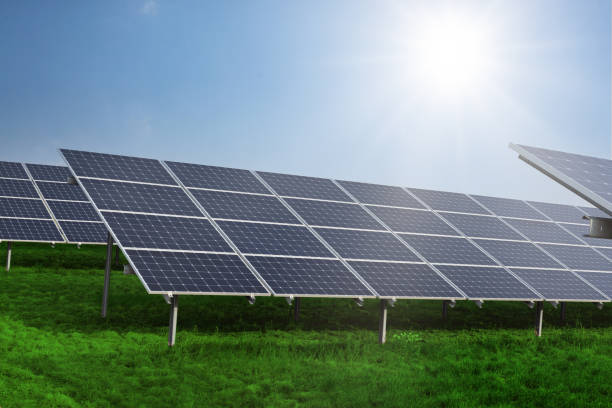 istock Solar panels on the sky background. Solar power plant. Blue solar panels. Alternative source of electricity. Solar farm. 1353766964