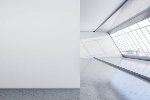 istock Modern concrete interior with mock up place on empty wall, panoramic window with city view and daylight. Minimalism concept. 3D Rendering. 1353767415