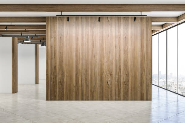 istock Modern concrete interior with mock up place on empty wooden wall, panoramic window with city view and daylight. Minimalism concept. 3D Rendering. 1353767517