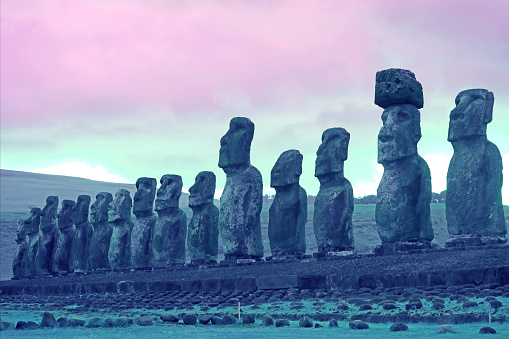 Pop Art Style Purple Blue Colored Moai stone statues of Ahu Tongariki ceremonial platform on Easter Island, Archaeological Site in Chile