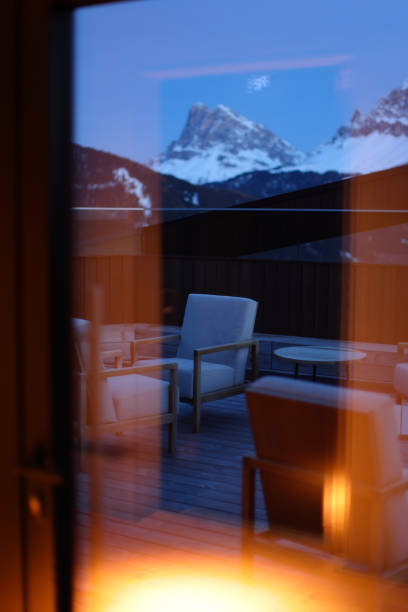 Rooftop furniture with mountains background.