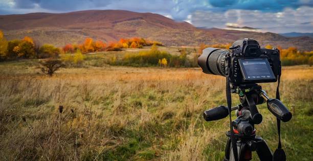 Shooting a landscape in the autumn Carpathian mountains