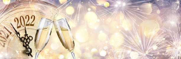 istock New Year 2022 - Celebration With Champagne And Clock - Abstract Defocused Lights 1353774459