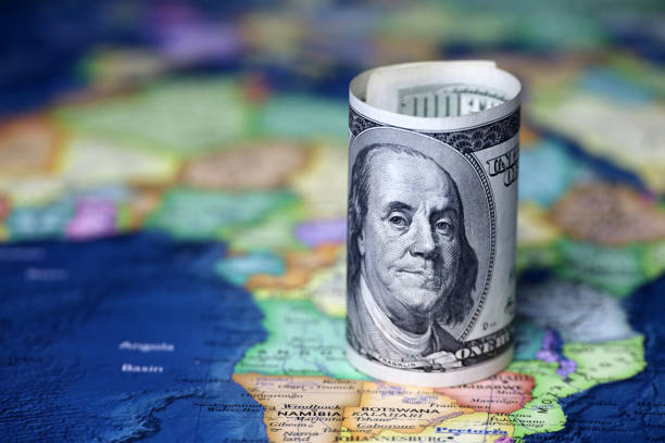 istock US dollars on the Africa map background 1353775348