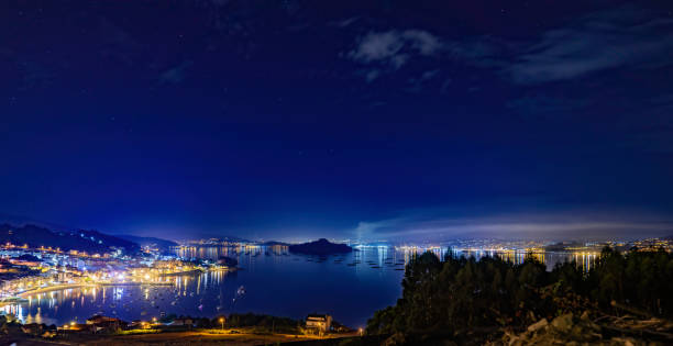 istock Panoramic view of coastal villages at night 1353775666