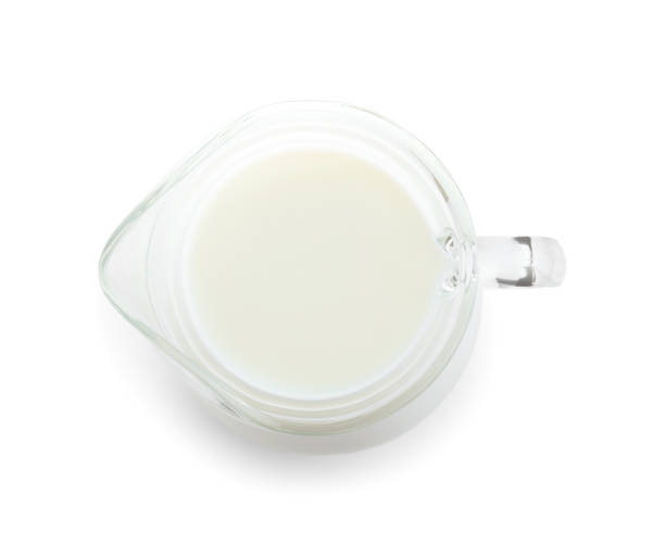 istock Jug of fresh milk isolated on white, top view 1353780463