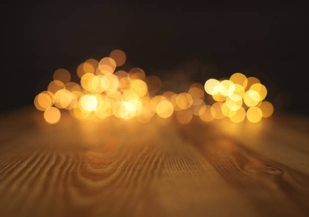 istock Empty wooden surface and blurred lights on background. Bokeh effect 1353780528