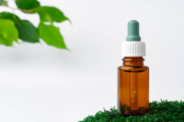 istock Cosmetics in a bottle, essential oil on moss 1353783166