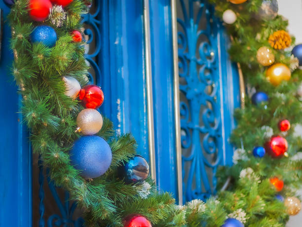 istock Christmas wreath on blue door 1353783351