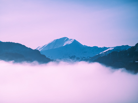 Surreal mountain with fantastic purple fog