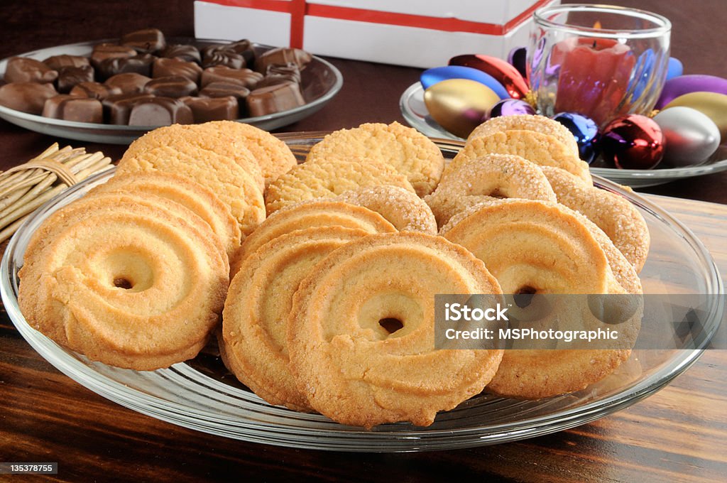 Christmas cookies and chocolates A plate of Danish butter cookies with chocolates and Christmas decorations Candy Stock Photo