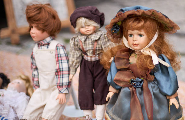 istock Rtro and vintage dolls. Handmade toy. Close-up old doll. 1353787984