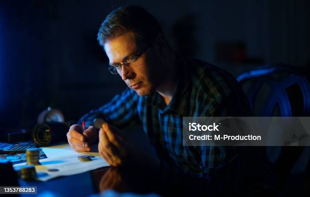 Male Numismatist Examines Collection Of Coins Stock Photo - Download Image Now - Numismatics, Antique, Coin
