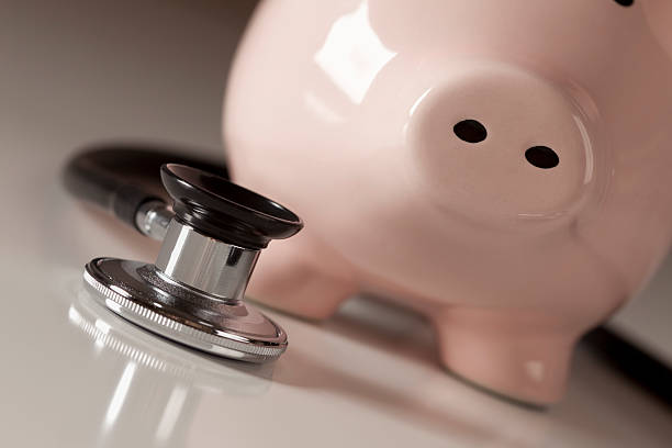 istock Piggy Bank and Stethoscope with Selective Focus 135379414