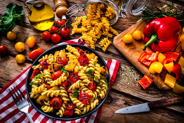 istock Preparing healthy pasta salad plate 1353794182
