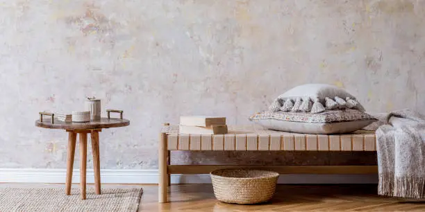 Photo of Interior design of boho living room. Oriental concept of home decor. Wabi sabi. Template.