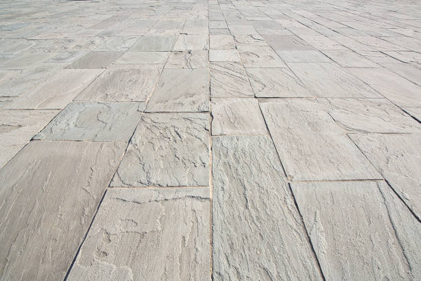 istock New paving made with gray split stone blocks of rectangular shape in a pedestrian zone 1353800355