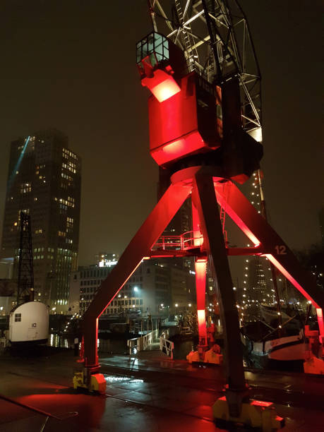 Leuvehaven Rotterdam - old red harbor crane illuminated by night