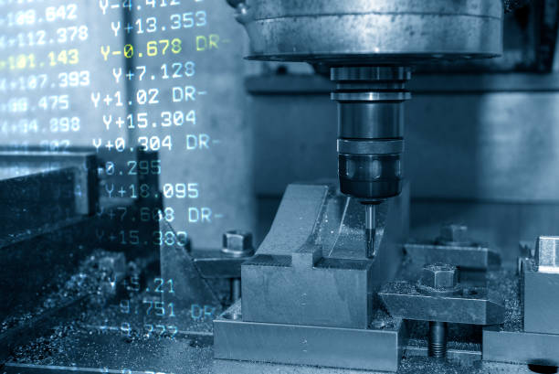 istock The abstract scene CNC milling machine cutting the stamping die parts and G-code data background. 1353801334
