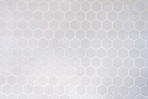 istock Tiles. A white marble wall with hexagon tiles for texture and background. White marble wall with hexagon pattern. 1353801431