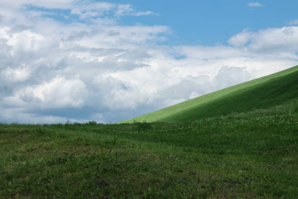 istock italian mountains landscape with green meadow 1353803504