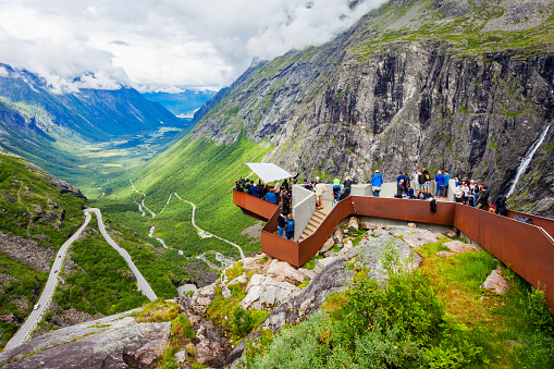 TROLLSTIGEN, NORWAY - JULY 30, 2017: Trollstigen viewing or viewpoint platform. Trollstigen or Trolls Path is a serpentine mountain road in Rauma Municipality in Norway