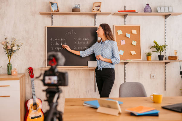 istock Female teacher giving German language lesson online 1353806827