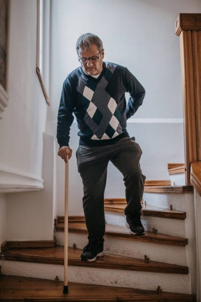 istock An older man with lower back pain 1353808731