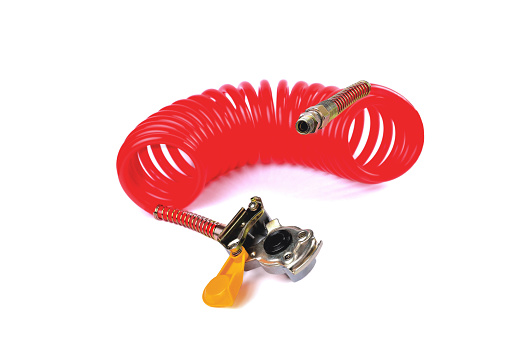 pneumatic hose and connecting head of a PALM truck for supplying compressed air from the tractor to the trailer, car accessories, car parts   white background close-up