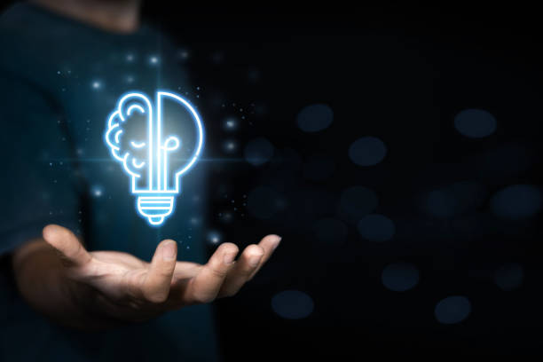 istock Businessman holding virtual light bulb and half brain on blue bokeh background smart thinking concept and innovative ideas inspired 1353813079