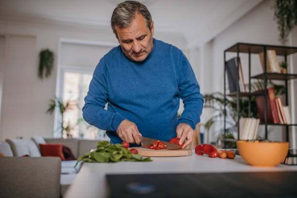 istock The chef cuts vegetables in the kitchen 1353813131