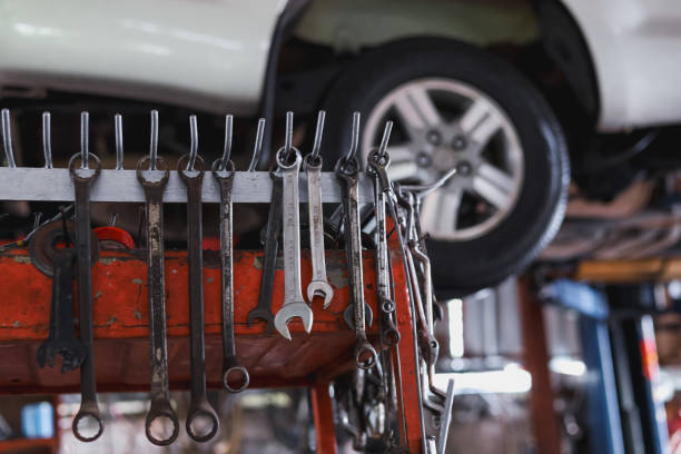 Wrench hanging on the mechanic's table in the garage.