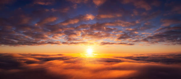 Beautiful dream-like photo of flying above the clouds Wide panorama of setting sun from the plane sunrise stock pictures, royalty-free photos & images