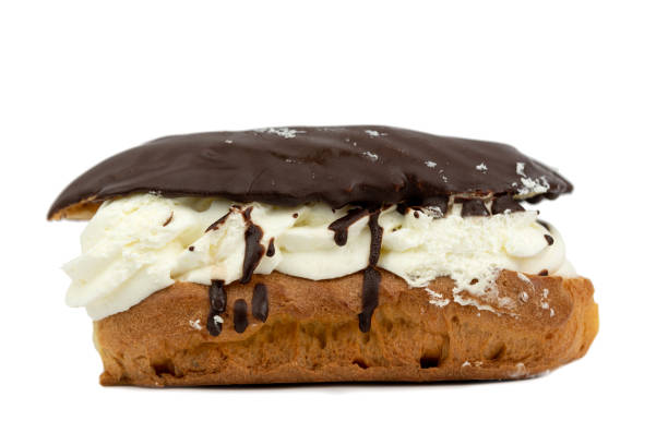 istock Chocolate eclair pasty cake with creamy vanilla 1353814877