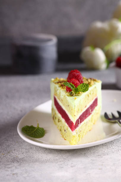 piece of cake with raspberries and pistachios