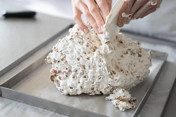 baker praparing nougat stock photo