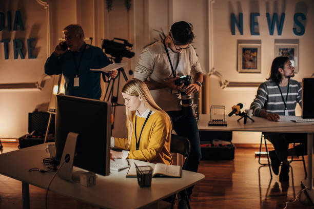 istock Busy night in news editorial office 1353816203