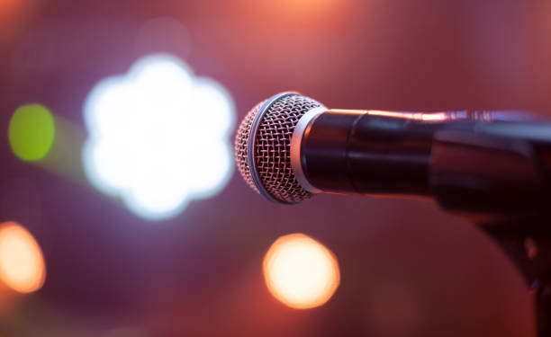 istock microphone on the stage and empty hall during the rehearsal 1353817884