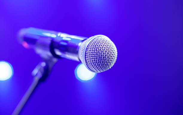 istock microphone on the stage and empty hall during the rehearsal 1353817919
