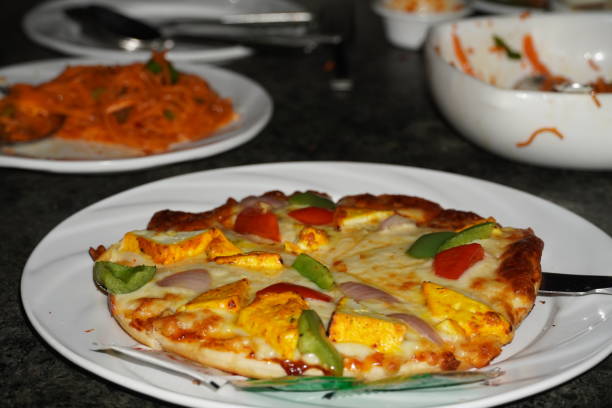 istock pizza with slice images plate 1353820643