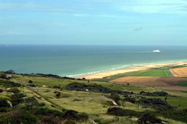 istock Green hill on the blue sea 1353821188