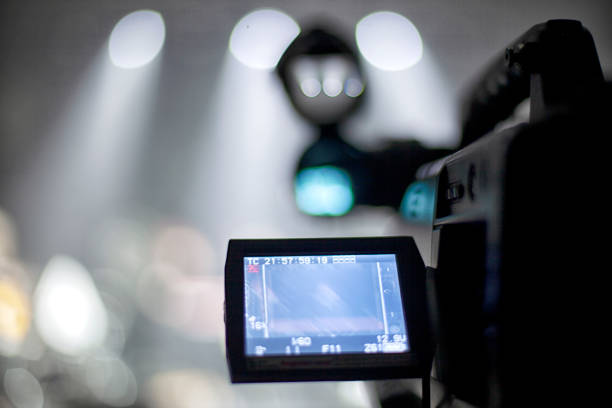 istock television camera. camera in a concert hall 1353822434