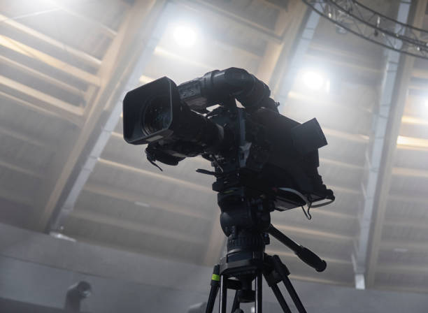 istock television camera. camera in a concert hall 1353822636