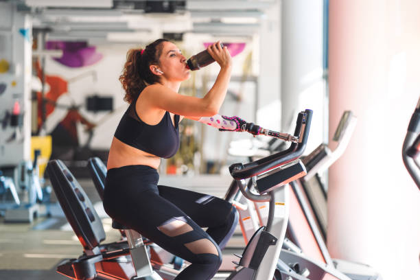 istock Disabled woman in gym 1353822851
