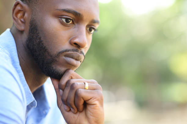 istock Worried husband with black skin thinking looking away 1353826710