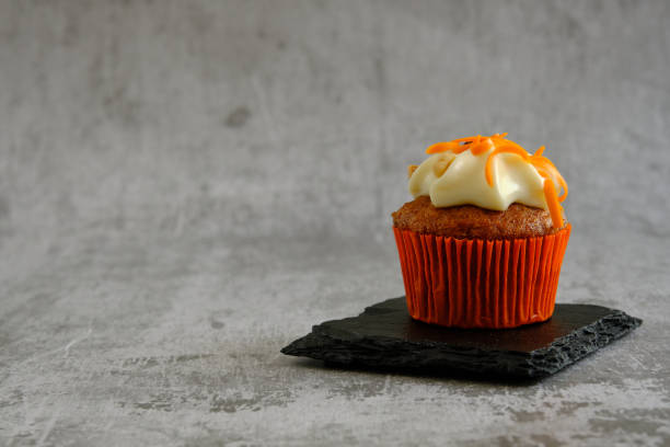 istock carrot muffin on a gray background 1353829300